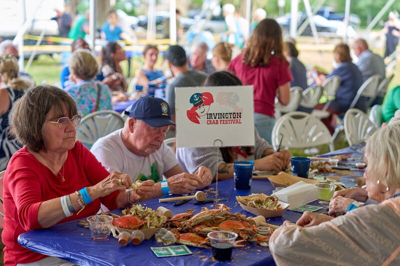 Table with Crab Festival sign